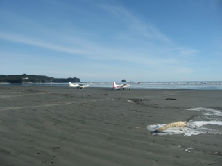 two planes by ocean